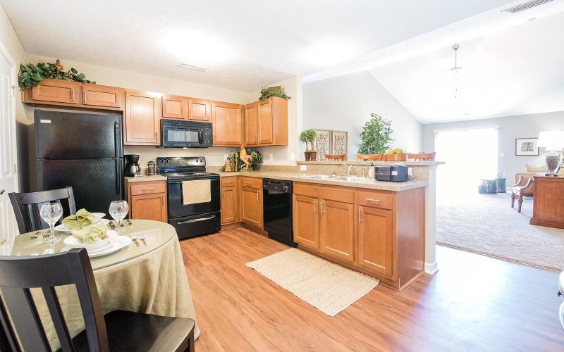 a kitchen with a table and chairs
