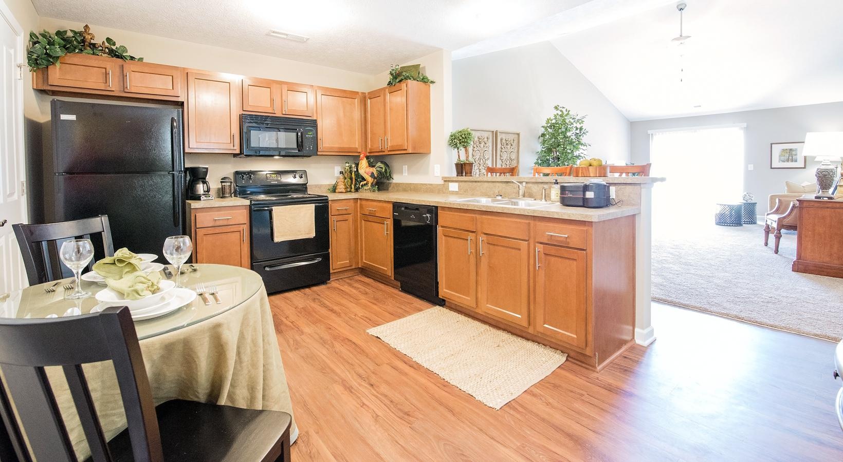 a kitchen with a table and chairs