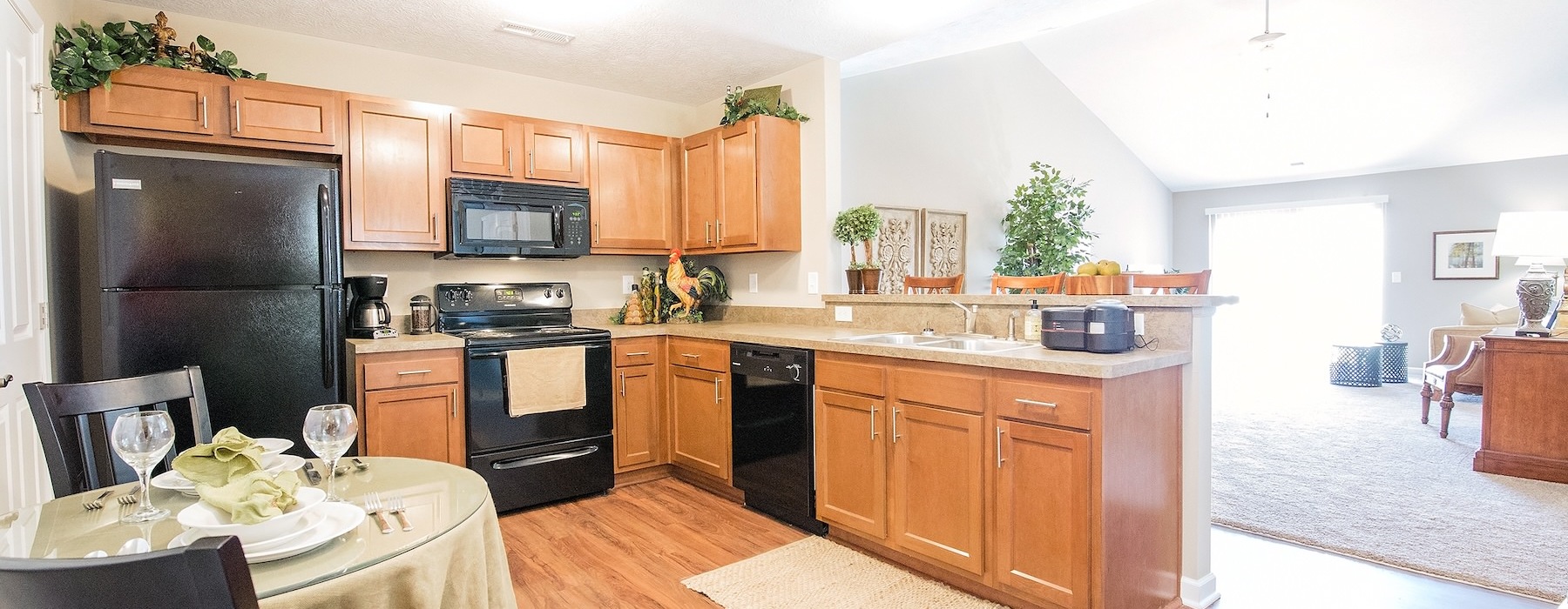 a kitchen with a table and chairs