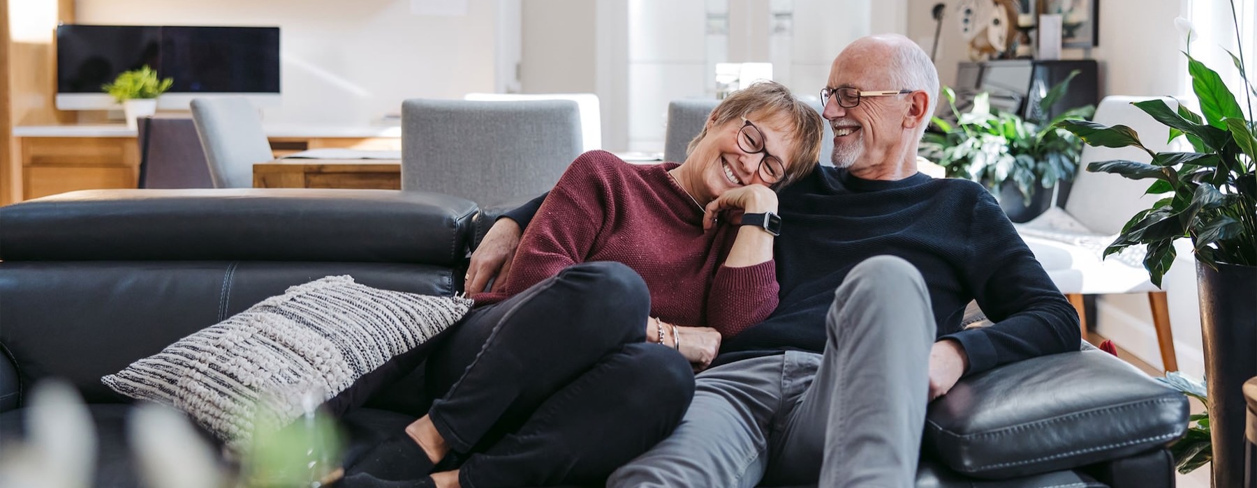 a man and woman sitting on a couch